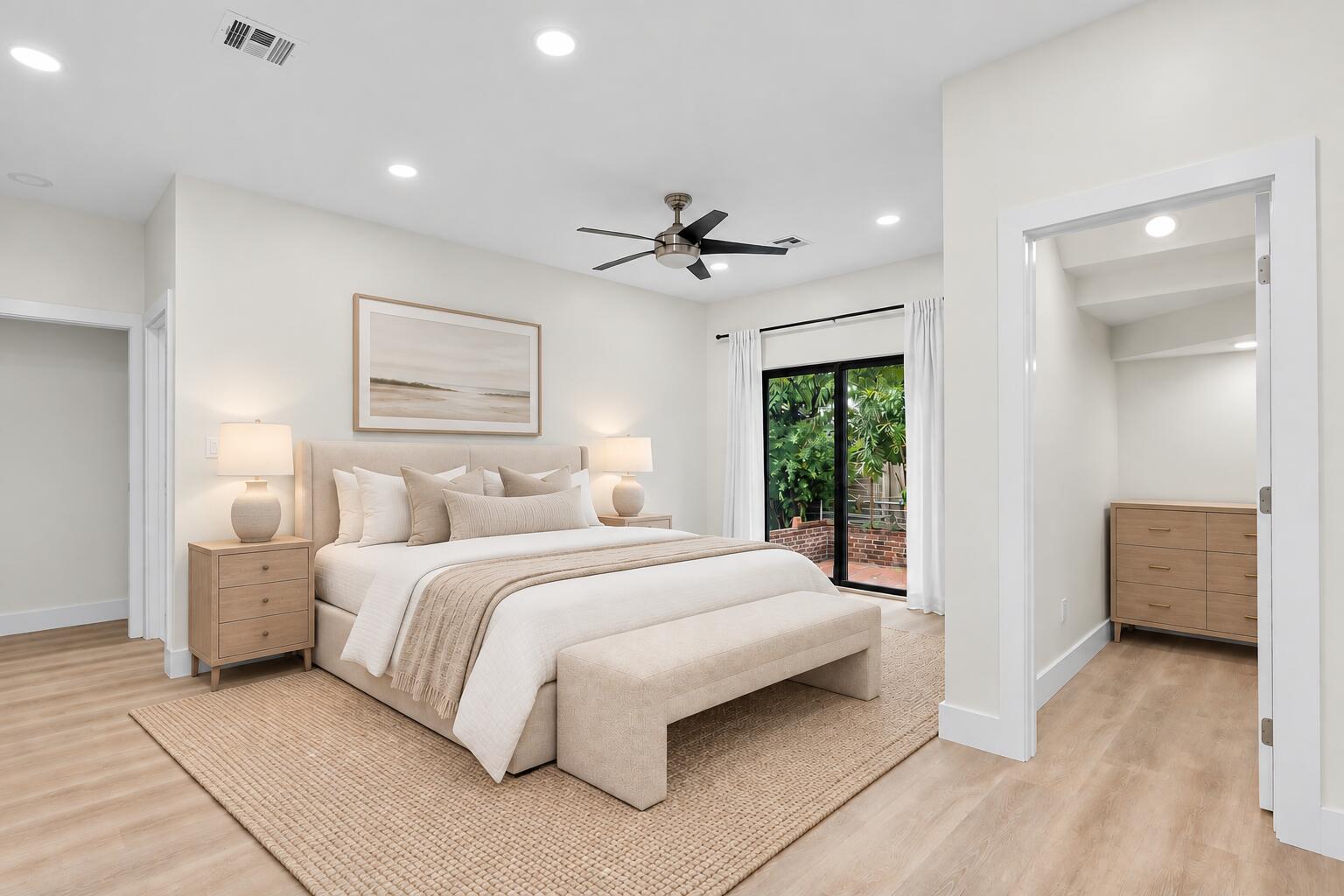 Bedroom with recessed lighting, a sliding glass door to the yard and an open walk-in closet
